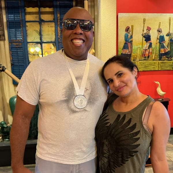 A man wearing a James Beard Foundation medal smiles next to a woman in Vietnam Philadelphia.